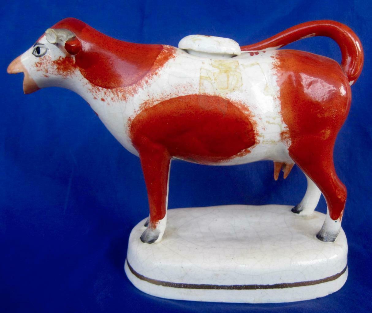 Antique Staffordshire Cow Creamer Raised Base Stopper Red Orange White 1800's